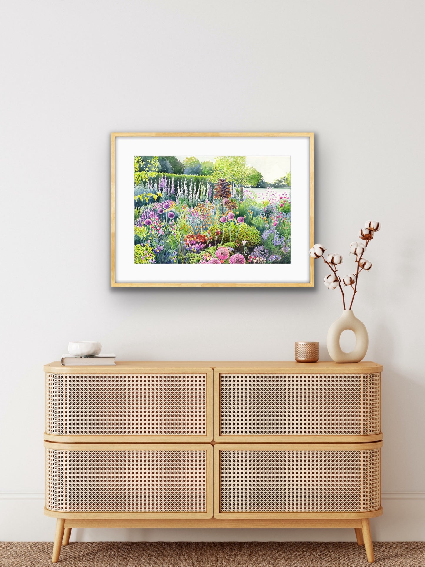Colourful Spring Summer garden landscape watercolour painting with flowers and plants in foreground and field behind