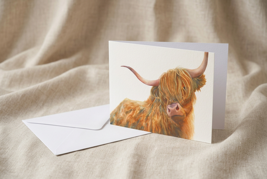 Highlander greeting card and white envelope on natural linen fabric